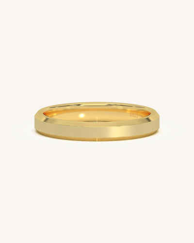 A wide edge gold vermeil sterling silver ring with a flat profile and sharp edges, presented on a clean background.
