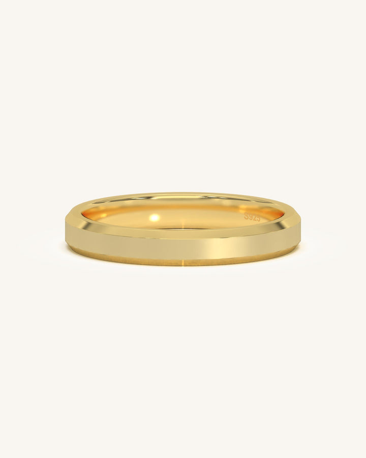 A wide edge gold vermeil sterling silver ring with a flat profile and sharp edges, presented on a clean background.