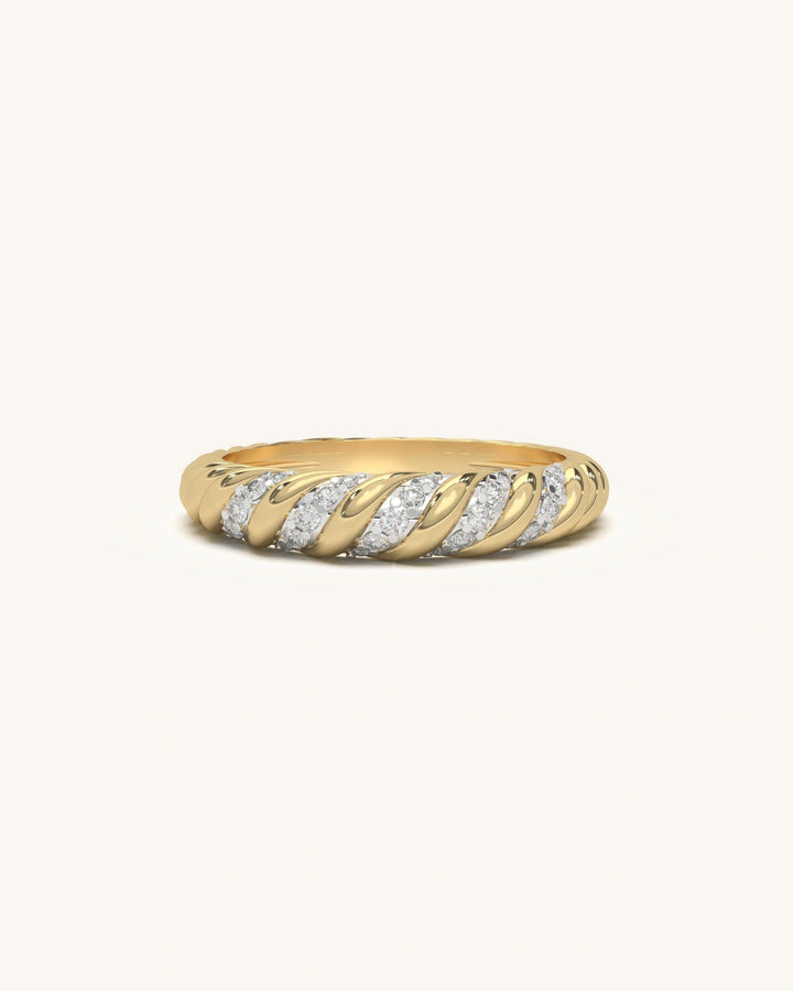 Gold-toned diagonal shine moissanite ring with thin twisted bands and consistent diamond setting.