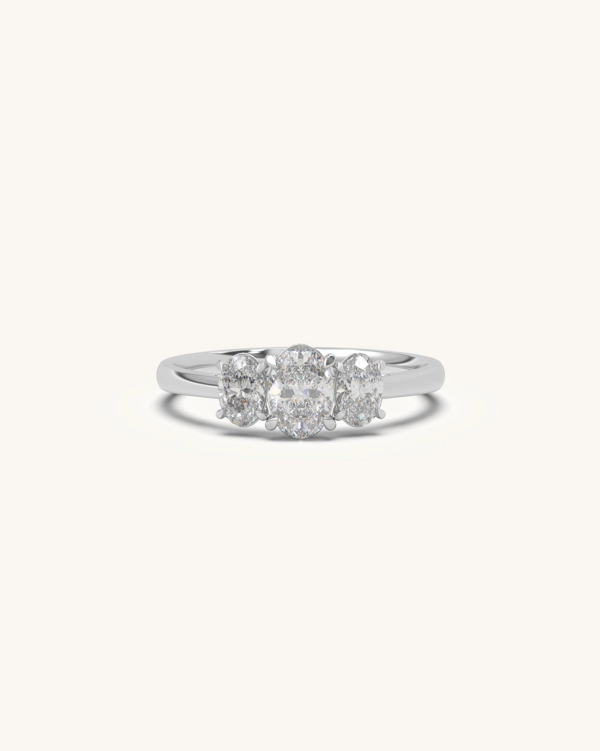 Oval trio diamond ring with elegant three stone setting