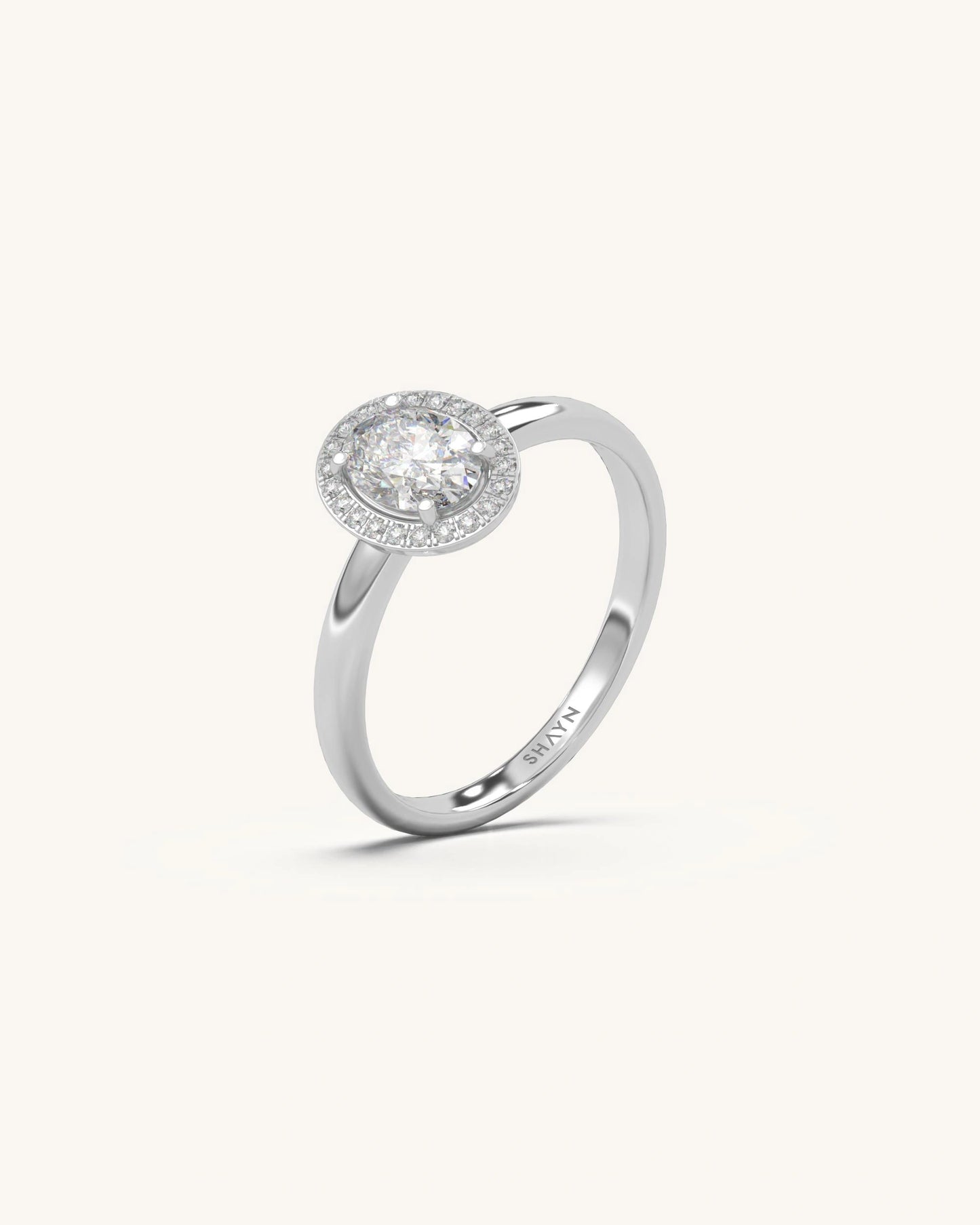 Oval halo diamond ring with radiant center and sparkling halo