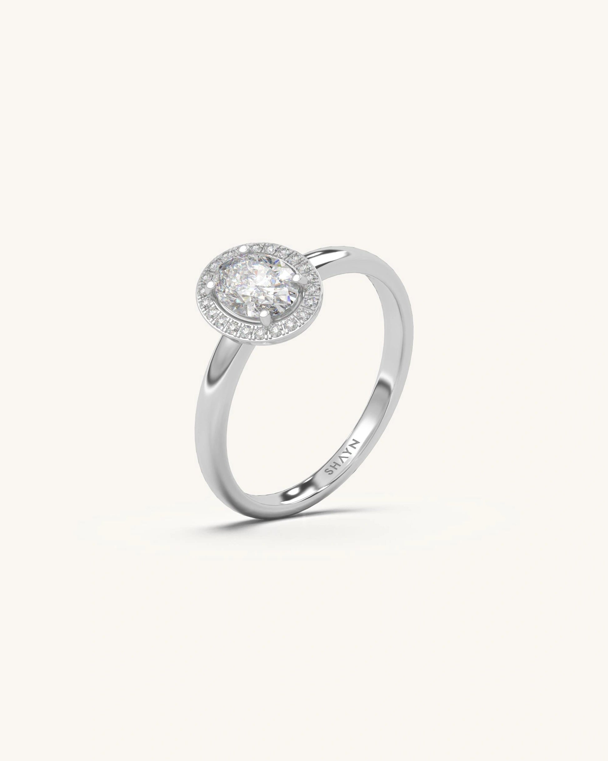 Oval halo diamond ring with radiant center and sparkling halo
