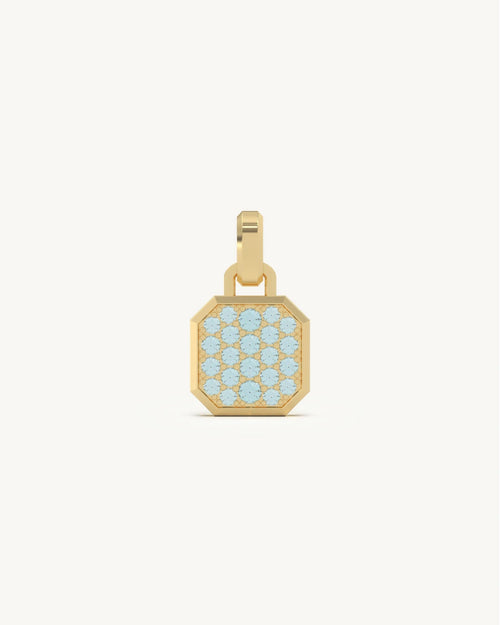 Aquamarine pendant with light blue pave stones and gold frame