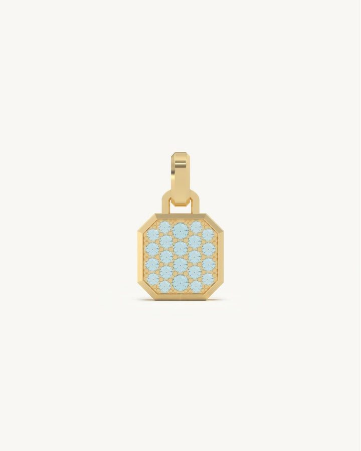 Aquamarine pendant with light blue pave stones and gold frame