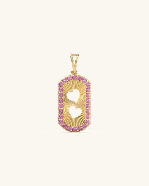 Heart shape pendant with pink stone border and yellow gold texture