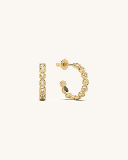 Modern vertical bezel stud earrings in 18KT gold vermeil with multiple moissanite diamonds, arranged linearly on a white background