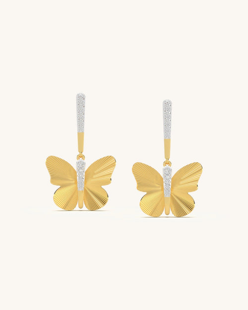 A pair of textured golden wing earrings with sparkling moissanite stones, crafted in 18K gold vermeil and 925 sterling silver.