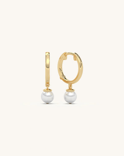 Model wearing 18K gold vermeil 925 sterling silver hoop pearl earrings with suspended round pearl drop from SHAYN jewelry