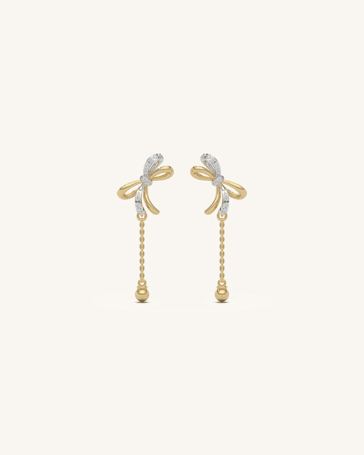 Pair of delicate mini ribbon studs in 18KT gold vermeil with moissanite, shown on a white background.