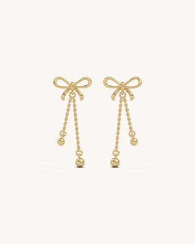 Elegant long bow drop earrings featuring 18KT gold vermeil, 925 sterling silver, and sparkling moissanite diamonds, perfect for a sophisticated look.