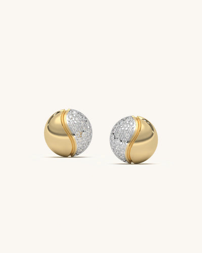 Close-up of Round Stud Earrings in two-tone 18KT Gold Vermeil and moissanite diamond design, showcasing their compact size and classic appeal on an earlobe.
