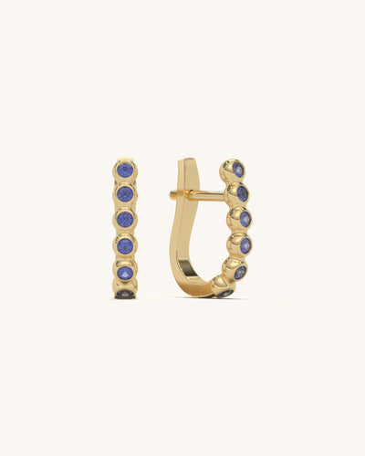 Pair of blue stone hoop earrings in 18KT gold vermeil and 925 sterling silver, with secure clasp