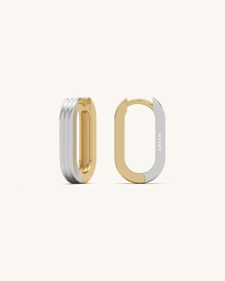 Ribbed U huggie earrings in 18K gold vermeil, showcasing the unique stacked, triple-bar design and modern texture.