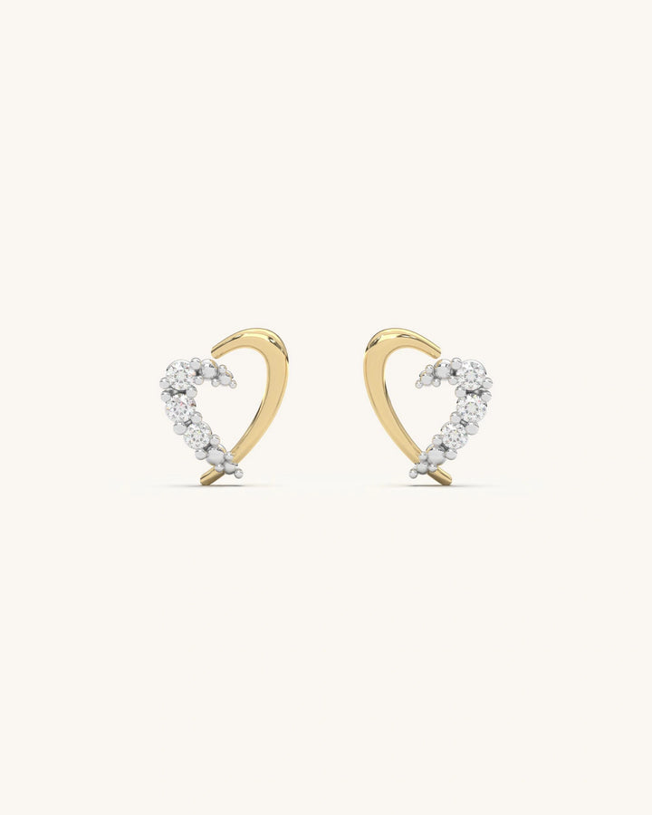 Close-up of SHAYN Curved Heart Studs in 18K Gold Vermeil with Moissanite stones on 925 Sterling Silver