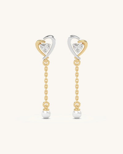 Elegant dual-tone 18KT Gold Vermeil 925 Sterling Silver heart drop earrings with moissanite and pearl accents.