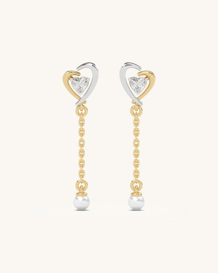 Elegant dual-tone 18KT Gold Vermeil 925 Sterling Silver heart drop earrings with moissanite and pearl accents.