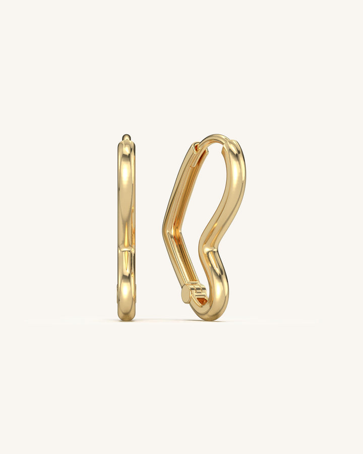 Pair of SHAYN Angular Heart Hoops in 18K Gold Vermeil on 925 Sterling Silver, showcasing their unique prismatic design